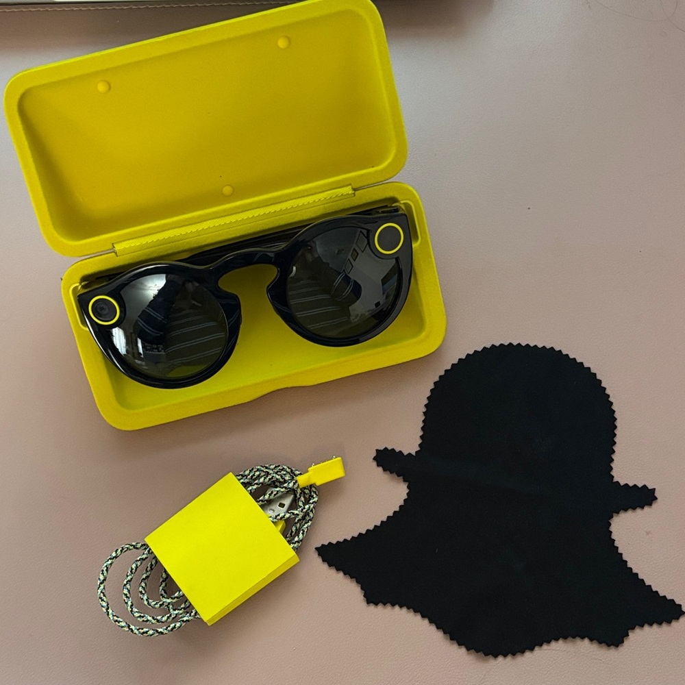 Snapchat Spectacles with case, charging cable, and original cleaning cloth